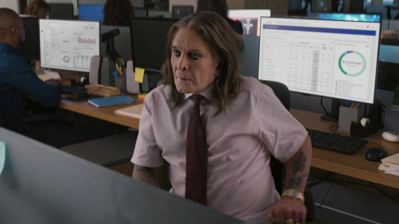 photo of ozzy the rock star in shirt and tie at work